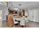 Bright kitchen features an island with granite countertop, custom cabinetry, and stainless steel appliances at 7080 Greatwood Trl, Alpharetta, GA 30005