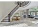 Grand foyer showcasing the staircase, and leading to a spacious living area at 7080 Greatwood Trl, Alpharetta, GA 30005