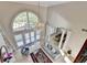 Grand living room with soaring ceilings, large windows, and elegant decor at 7080 Greatwood Trl, Alpharetta, GA 30005