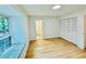Bedroom featuring wood-look floors, window seat and an en suite bathroom and closet at 102 Adrian Nw Pl, Atlanta, GA 30327