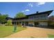 Cross Creek building exterior with balcony, large windows and beautiful landscaping at 102 Adrian Nw Pl, Atlanta, GA 30327
