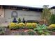 Exterior shot of the Cross Creek Cafe featuring lush, mature landscaping around the building at 102 Adrian Nw Pl, Atlanta, GA 30327