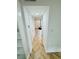 Bright hallway with herringbone floors and white doors at 102 Adrian Nw Pl, Atlanta, GA 30327