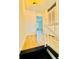 Bright hallway featuring wood-look floors and a view of the backyard through a window at 102 Adrian Nw Pl, Atlanta, GA 30327