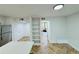 Bright kitchen with an island and shelves at 102 Adrian Nw Pl, Atlanta, GA 30327