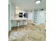 Modern kitchen boasts sleek countertops, stainless steel appliances, and stylish herringbone wood floors at 102 Adrian Nw Pl, Atlanta, GA 30327