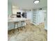Well-lit kitchen featuring an island, shelves, and stainless steel appliances at 102 Adrian Nw Pl, Atlanta, GA 30327