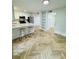 Contemporary kitchen with breakfast bar, offering views to additional rooms at 102 Adrian Nw Pl, Atlanta, GA 30327