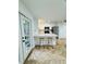 A kitchen with double doors to the backyard, countertop seating, and stainless appliances at 102 Adrian Nw Pl, Atlanta, GA 30327