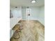 Bright living area featuring herringbone floors, modern lighting, and an open floor plan at 102 Adrian Nw Pl, Atlanta, GA 30327