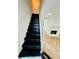 Modern staircase with wood herringbone floors at 102 Adrian Nw Pl, Atlanta, GA 30327