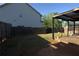 A lovely backyard with a wooden deck area, partially enclosed by a wooden fence at 2362 Glebe Ct, Hampton, GA 30228