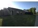 A nice backyard with a lawn and a view of the home exterior at 2362 Glebe Ct, Hampton, GA 30228
