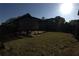 A green backyard with some landscaping and a covered structure, great for outdoor enjoyment at 2362 Glebe Ct, Hampton, GA 30228