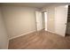 This carpeted bedroom features neutral walls and a closet with a white panel door at 2362 Glebe Ct, Hampton, GA 30228
