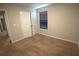 This carpeted bedroom features neutral walls and one window, offering a clean and comfortable space at 2362 Glebe Ct, Hampton, GA 30228