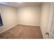This carpeted bedroom has neutral walls and one window, offering a clean and comfortable space at 2362 Glebe Ct, Hampton, GA 30228