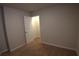 This carpeted bedroom features neutral walls and a closet with a white panel door at 2362 Glebe Ct, Hampton, GA 30228