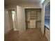 Walk-in closet featuring built-in shelves and drawers, providing ample storage space at 2362 Glebe Ct, Hampton, GA 30228