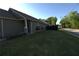 Well-kept lawn featuring flower boxes, professional landscaping, with a view of the street at 2362 Glebe Ct, Hampton, GA 30228