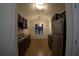 Modern kitchen featuring dark cabinets, stainless steel appliances, and hardwood flooring at 2362 Glebe Ct, Hampton, GA 30228