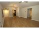 Inviting living space with durable flooring, a modern chandelier, and easy access to bathroom and kitchen at 2362 Glebe Ct, Hampton, GA 30228