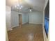 Bright living room featuring wood-look flooring, ceiling fan, and natural light at 2362 Glebe Ct, Hampton, GA 30228