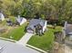 Aerial view of a two-story home with well-maintained lawn and landscaping in a residential area at 2523 Bancroft Way, Buford, GA 30519