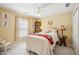 Cozy bedroom with a comfortable bed, decorative accents, and plenty of natural light at 2523 Bancroft Way, Buford, GA 30519