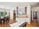 View of the open-concept kitchen and dining area with natural light streaming through the windows at 2523 Bancroft Way, Buford, GA 30519