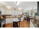 Spacious kitchen with an island and an adjoining dining area for casual meals at 2523 Bancroft Way, Buford, GA 30519