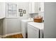 Convenient laundry room with modern machines and storage at 2523 Bancroft Way, Buford, GA 30519