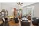 Cozy sitting room with a bay window, hardwood floors, and comfortable seating area at 2523 Bancroft Way, Buford, GA 30519
