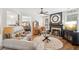 Comfortable living room with fireplace, hardwood floors, and neutral color palette at 2523 Bancroft Way, Buford, GA 30519