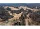 Scenic aerial view of a community golf course surrounded by lush trees and beautiful landscaping at 333 Gardens Of Harmony Dr, Canton, GA 30115