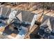 Aerial view of a lovely home with a manicured lawn, a two-car garage, and a charming neighborhood setting at 333 Gardens Of Harmony Dr, Canton, GA 30115