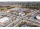 High-angle shot showcases a bustling commercial area with multiple businesses and ample parking at 333 Gardens Of Harmony Dr, Canton, GA 30115