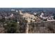 Aerial view of the residential area with golf course surrounded by trees at 333 Gardens Of Harmony Dr, Canton, GA 30115