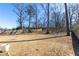 Large fenced backyard is ready for outdoor entertaining and activities at 333 Gardens Of Harmony Dr, Canton, GA 30115