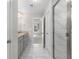 Bright bathroom features a double vanity with granite countertops and tiled shower at 333 Gardens Of Harmony Dr, Canton, GA 30115