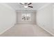 Spacious bedroom with a ceiling fan and large window provides a bright and airy atmosphere at 333 Gardens Of Harmony Dr, Canton, GA 30115