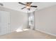 Neutral bedroom features a ceiling fan, natural light from a window, and a closet at 333 Gardens Of Harmony Dr, Canton, GA 30115