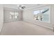 Expansive bedroom with neutral carpet, crown molding, ceiling fan and large windows offering natural light at 333 Gardens Of Harmony Dr, Canton, GA 30115