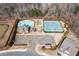 Aerial view of community amenities with pool, tennis courts, clubhouse, playground and parking at 333 Gardens Of Harmony Dr, Canton, GA 30115