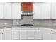 Well-lit kitchen featuring white cabinetry, stainless steel appliances, and stylish granite countertops at 333 Gardens Of Harmony Dr, Canton, GA 30115
