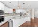 Modern kitchen with stainless steel appliances, granite countertops, and a large island at 333 Gardens Of Harmony Dr, Canton, GA 30115