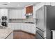 Spacious kitchen features stainless steel appliances, granite countertops and an island perfect for entertaining at 333 Gardens Of Harmony Dr, Canton, GA 30115