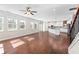Bright open-concept living room with hardwood floors and a view to the kitchen at 333 Gardens Of Harmony Dr, Canton, GA 30115
