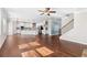 Open concept living space connecting the living room, kitchen, and entryway at 333 Gardens Of Harmony Dr, Canton, GA 30115