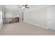 Bright and open loft area with neutral carpet, elegant railings, and ample space for a home office or play area at 333 Gardens Of Harmony Dr, Canton, GA 30115